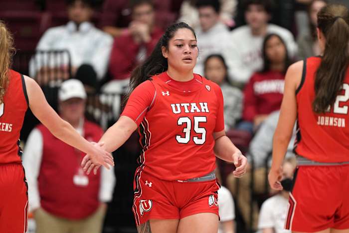 Jan 20, 2023; Stanford, California, USA; Utah Utes forward Alissa Pili (35) is congratulated by guard Gianna Kneepkens (left) and forward Jenna Johnson (right) during the third quarter against the Stanford Cardinal at Maples Pavilion. Mandatory Credit: Darren Yamashita-USA TODAY Sports